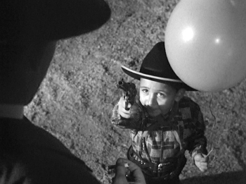 strangers-on-a-train-cowboy-kid